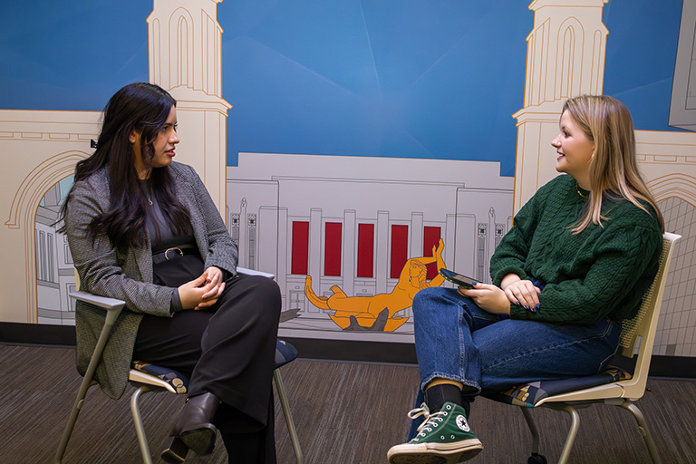 Daniela Molina sits and talks to Emerson Elledge.